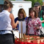 Jane Wohletz attends to customers